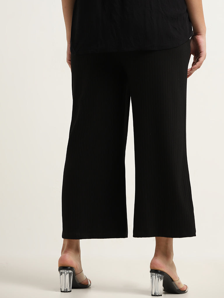 Gia Black Ribbed Mid Rise Flared Pants